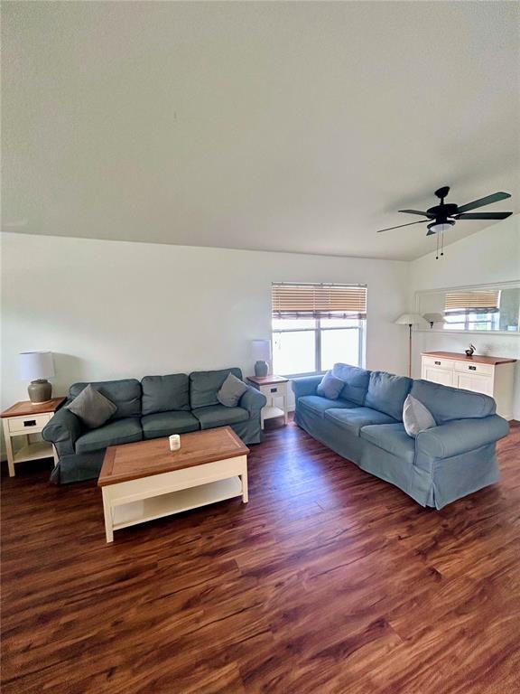 A kitchen features blue cabinets, white countertops, a subway tile backsplash, and stainless steel appliances — 1061 PORTMOOR WAY, WINTER GARDEN, FL