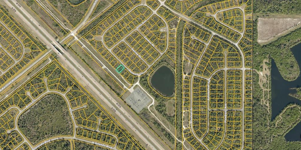 This is an aerial map showing a highlighted residential lot within a suburban neighborhood — 1151219204 DEVONIA CIRCLE, NORTH PORT, FL