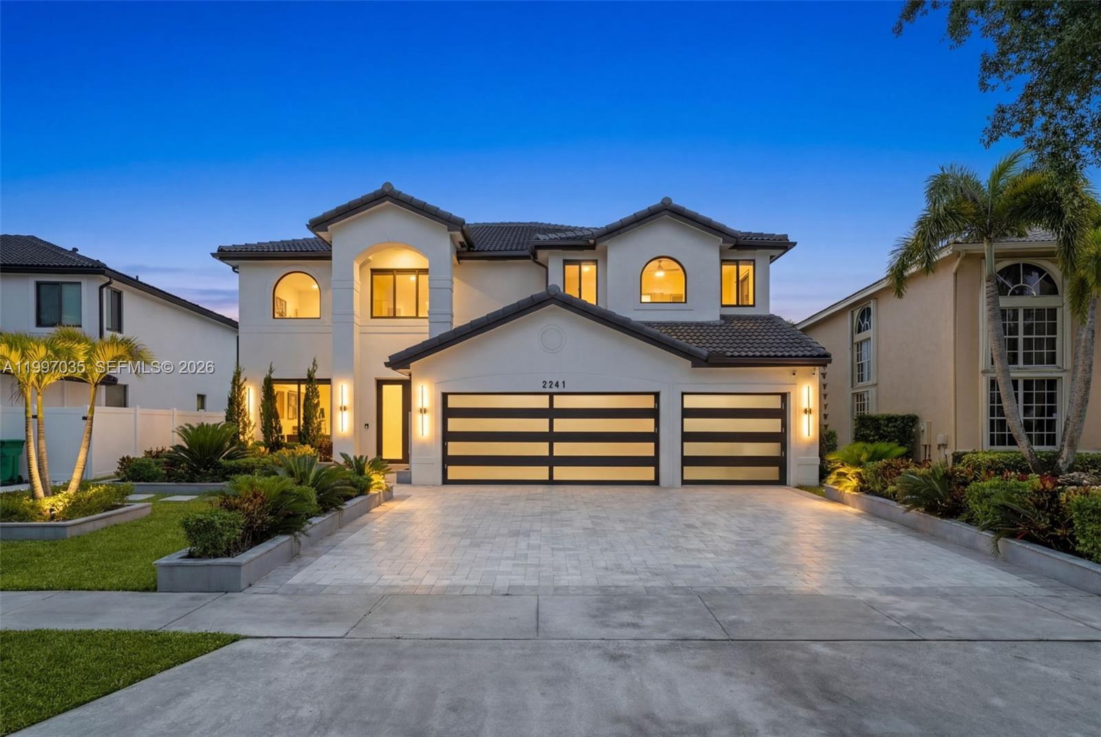 A two-story house with a white exterior, tiled roof, and a three-car garage — 2241 SW 164th Ave, Miramar FL 33027, MIRAMAR, FL