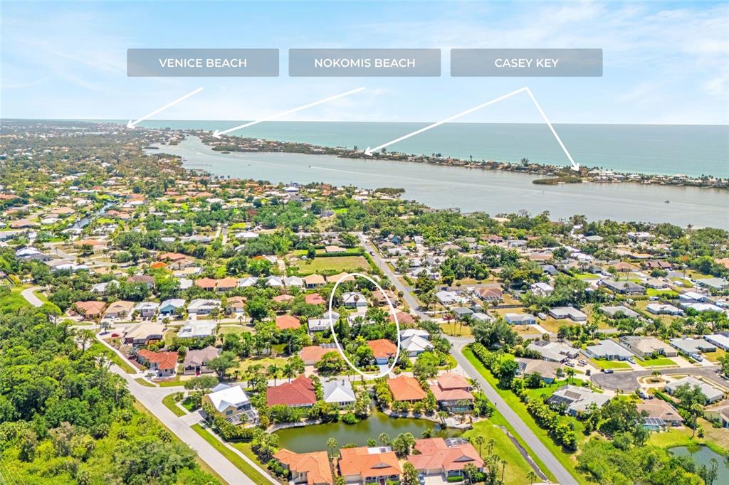 This aerial view shows a residential neighborhood near the coast with a highlighted house — 400 TORTUGA DRIVE, NOKOMIS, FL