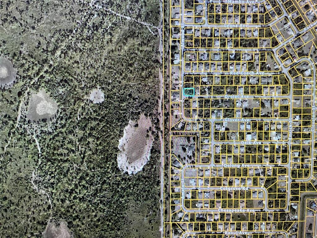 This is an aerial map showing a vacant lot highlighted in blue within a residential neighborhood — LOT 1 ALWOOD STREET, NORTH PORT, FL