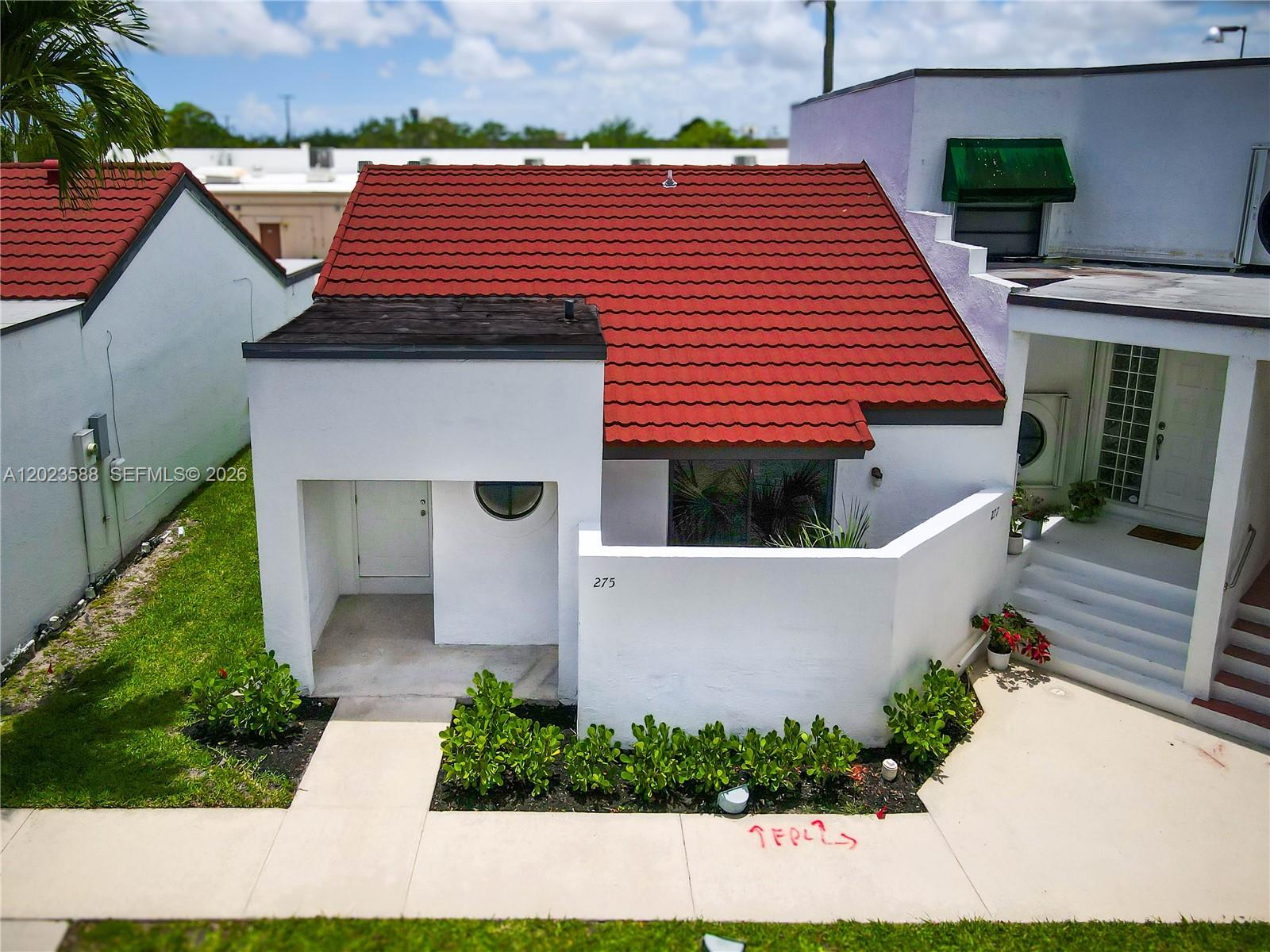 A white stucco house with a red tile roof and a circular window — 275 NW 36th Ave # 275, Deerfield Beach FL 33442, DEERFIELD BEACH, FL