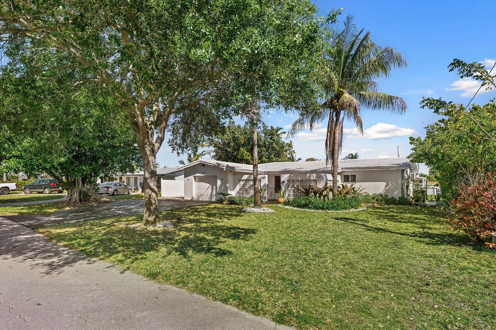 A single-story house with a white exterior, a garage, and a large front yard — 421 SW 18th Street, Pompano Beach FL 33060, POMPANO BEACH, FL