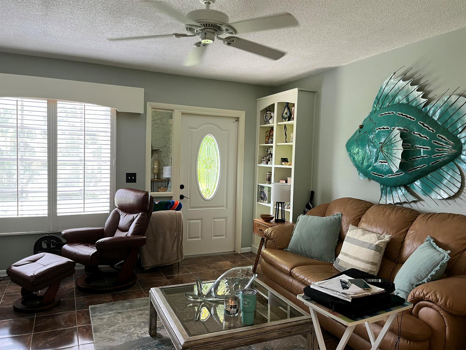 A white single-story house with a tiled walkway, palm trees, and a green lawn — 915 Riverwood Lane, Jupiter FL 33458, JUPITER, FL