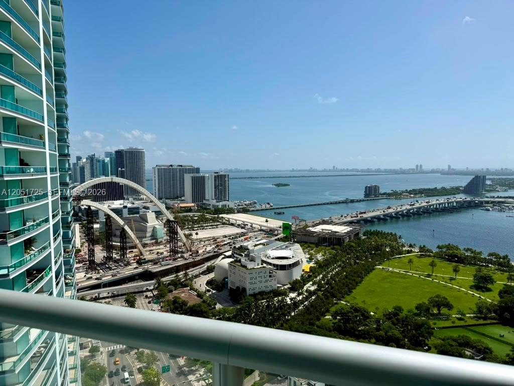 A high-angle view shows a city skyline, a bridge over water, and a green park — 888 Biscayne Blvd # 3611, Miami FL 33132, MIAMI, FL