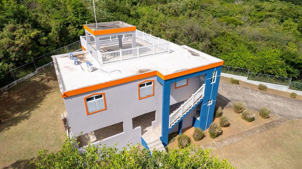 An aerial view of a two-story house with a rooftop terrace and blue accents — 78 HIDDEN PARADISE, VIEQUES, PR