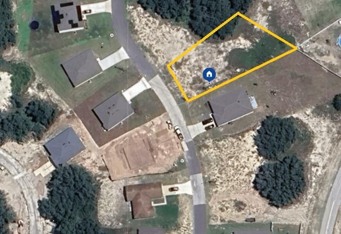 This aerial map shows a vacant residential lot outlined in yellow within a suburban neighborhood — 1411 ORLANDO COURT, KISSIMMEE, FL