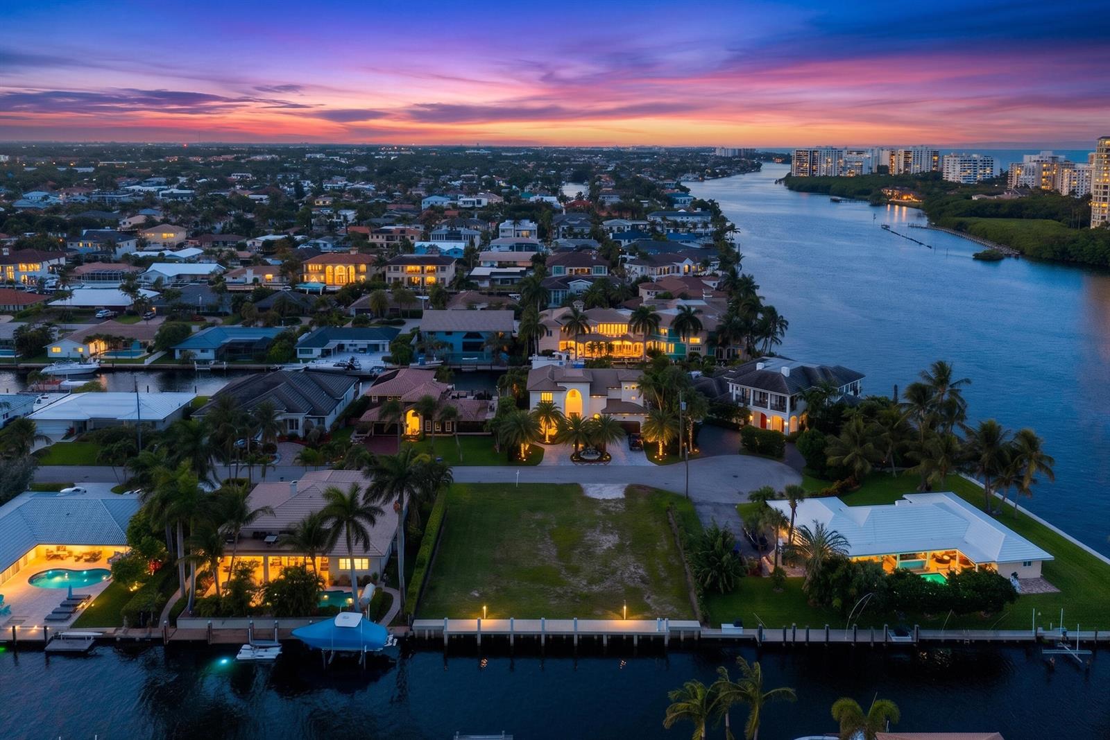 An aerial view of a waterfront neighborhood at sunset featuring a vacant residential lot — 876 Forsyth Street, Boca Raton FL 33487, BOCA RATON, FL