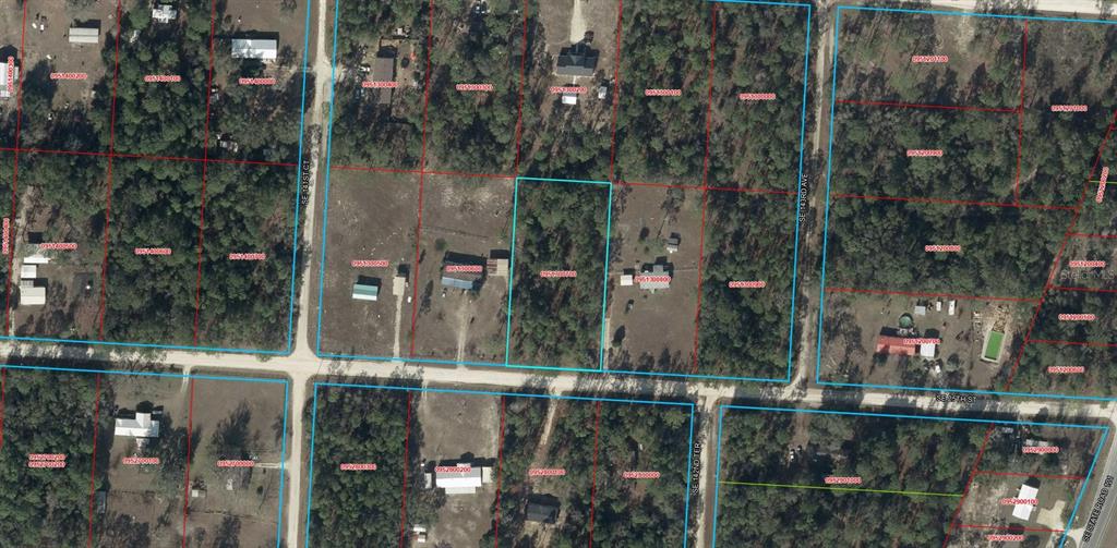 This is an aerial map view showing several residential lots, wooded areas, and dirt roads — 0000 SE 25TH STREET, MORRISTON, FL