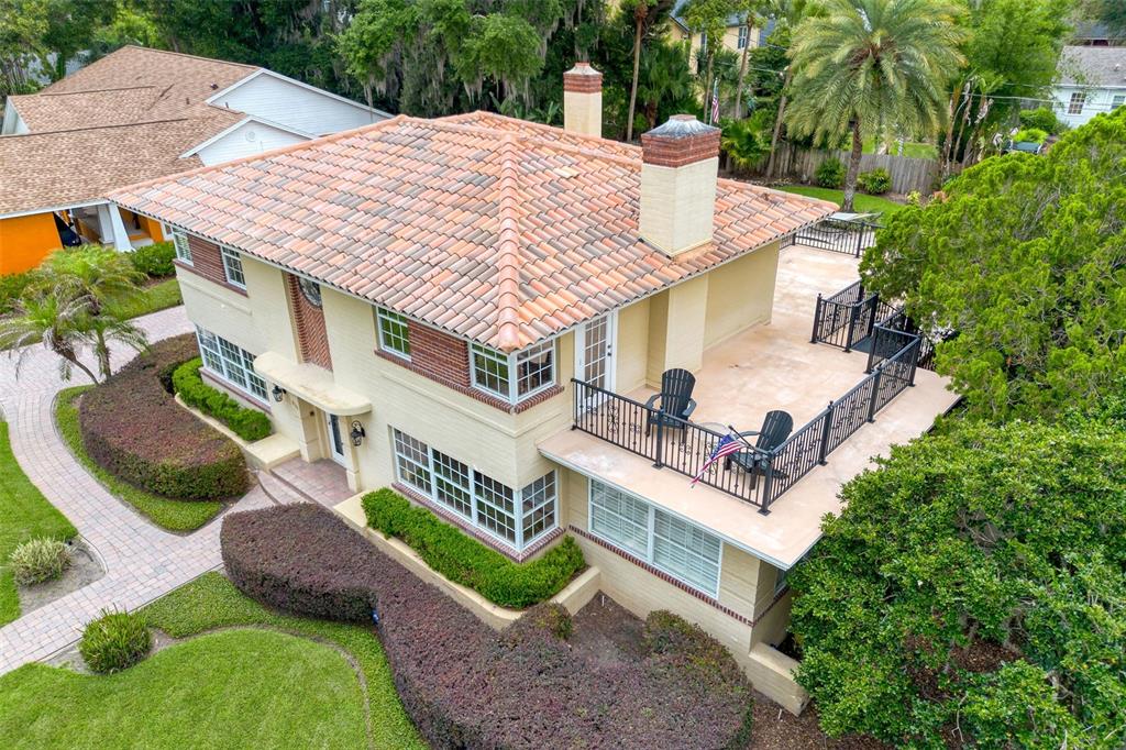 An aerial view of a two-story house with a tile roof and a large balcony — 830 LAKE DAVIS DRIVE, ORLANDO, FL