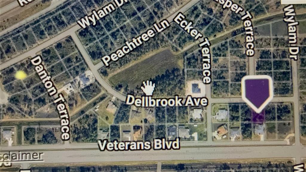 This is a map showing a residential area with street names and a property marker — DELLBROOK AVENUE, NORTH PORT, FL