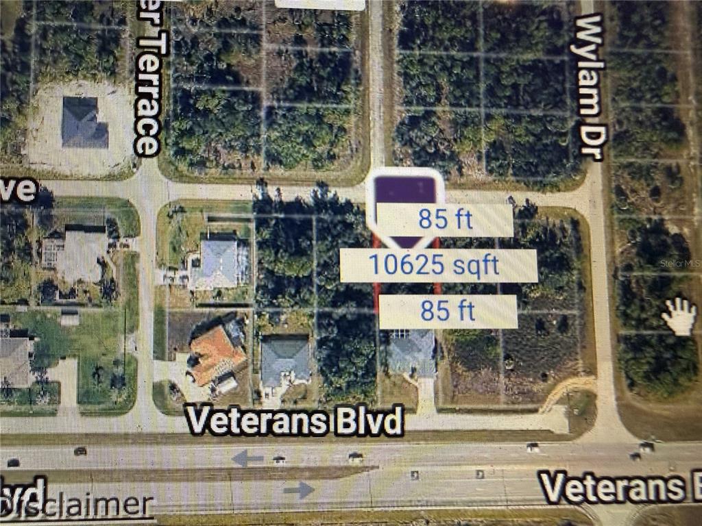 This is a satellite map view of a rectangular residential lot on Veterans Boulevard — DELLBROOK AVENUE, NORTH PORT, FL