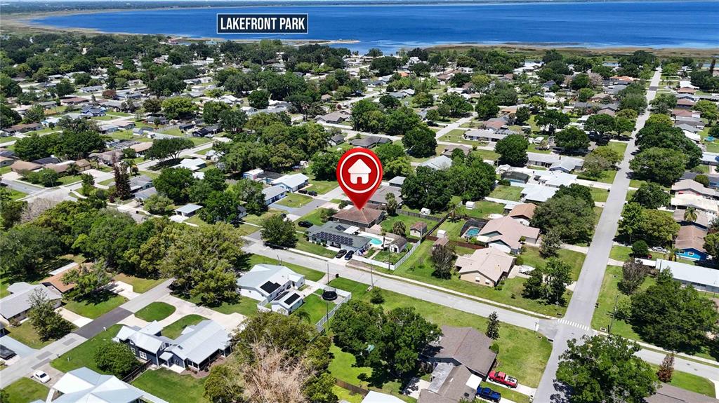 An aerial view shows a residential neighborhood with a red house icon marking a property — 439 VIRGINIA AVENUE, ST CLOUD, FL