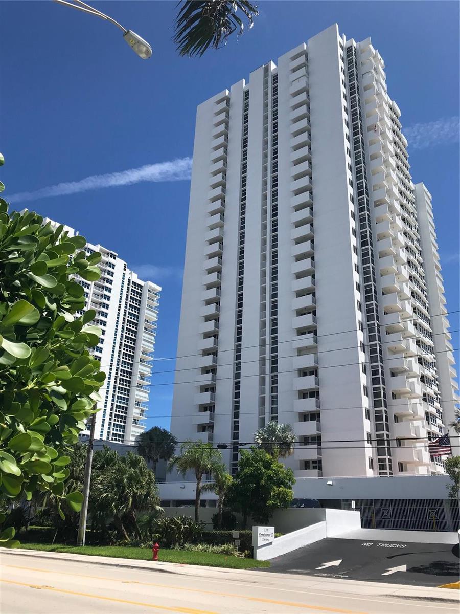 A tall white residential high-rise building stands against a clear blue sky — 1370 S Ocean Boulevard S # 1403, Pompano Beach FL 33062, POMPANO BEACH, FL