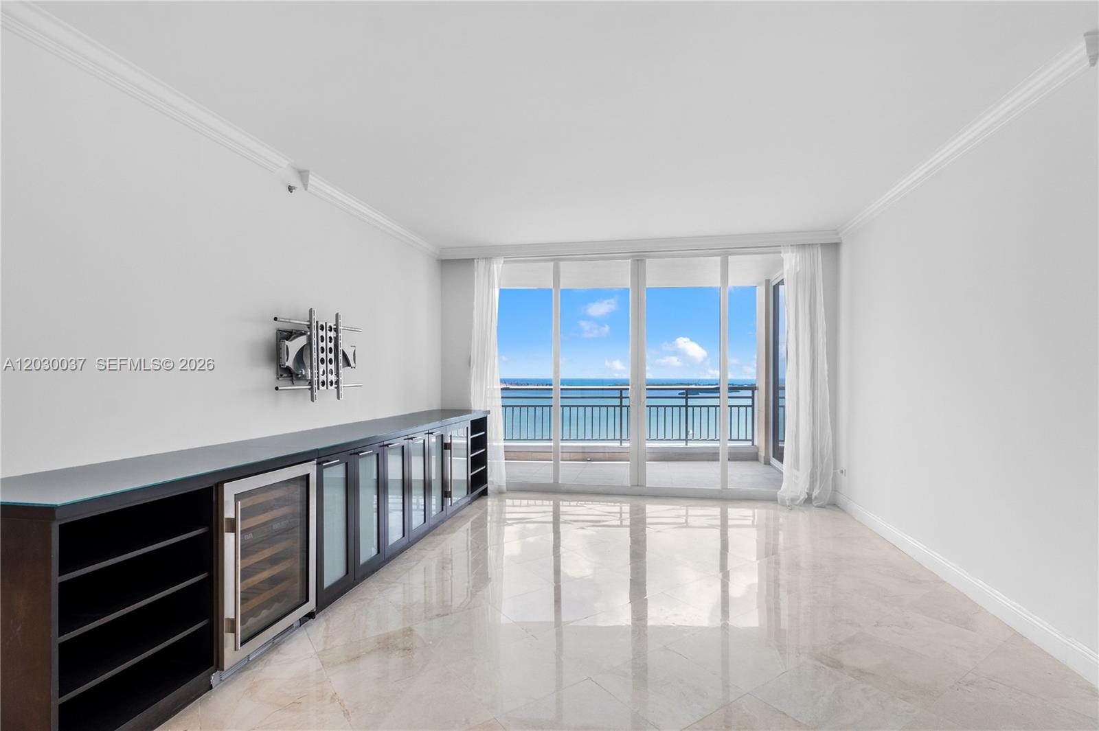 A bright living area features marble floors, a built-in wine cooler, and a balcony view — 808 Brickell Key Dr # 3002, Miami FL 33131, MIAMI, FL