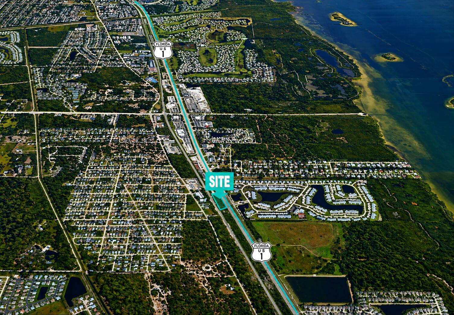 An aerial view shows a development site located along Florida US 1 near residential areas — 1437 U.s. 1, Vero Beach FL 32960, VERO BEACH, FL