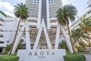 The exterior of a tall white residential building features a large triangular entrance structure — 6365 Collins Ave # 2201, Miami Beach FL 33141, MIAMI BEACH, FL