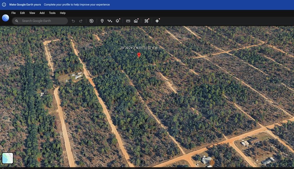 This is an aerial map view of a wooded, undeveloped residential lot with dirt roads — 1802 FERN AVENUE, INTERLACHEN, FL