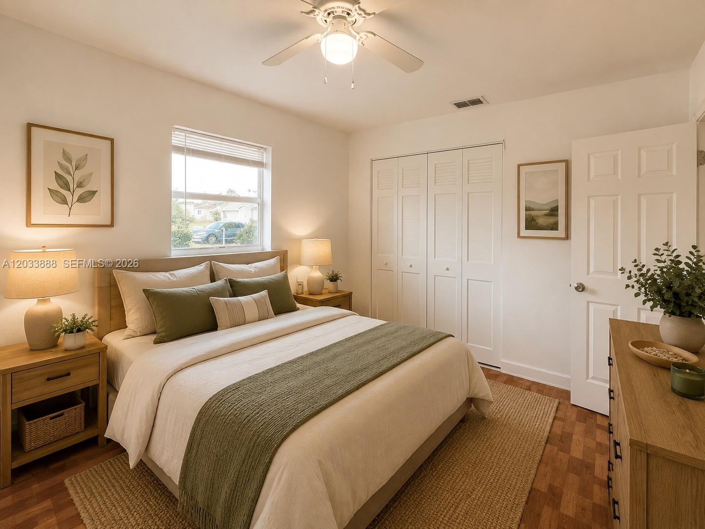 A bedroom features a queen bed, wooden nightstands, a closet, and a ceiling fan — 20500 NW 28th Ave # A, Miami Gardens FL 33056, MIAMI GARDENS, FL