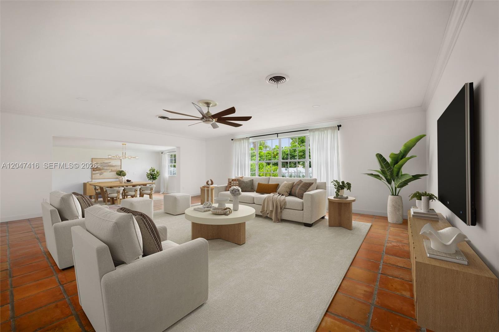 This is a digitally staged living room featuring terracotta tile floors and a neutral sofa — 8345 SW 90th St, Miami FL 33156, MIAMI, FL