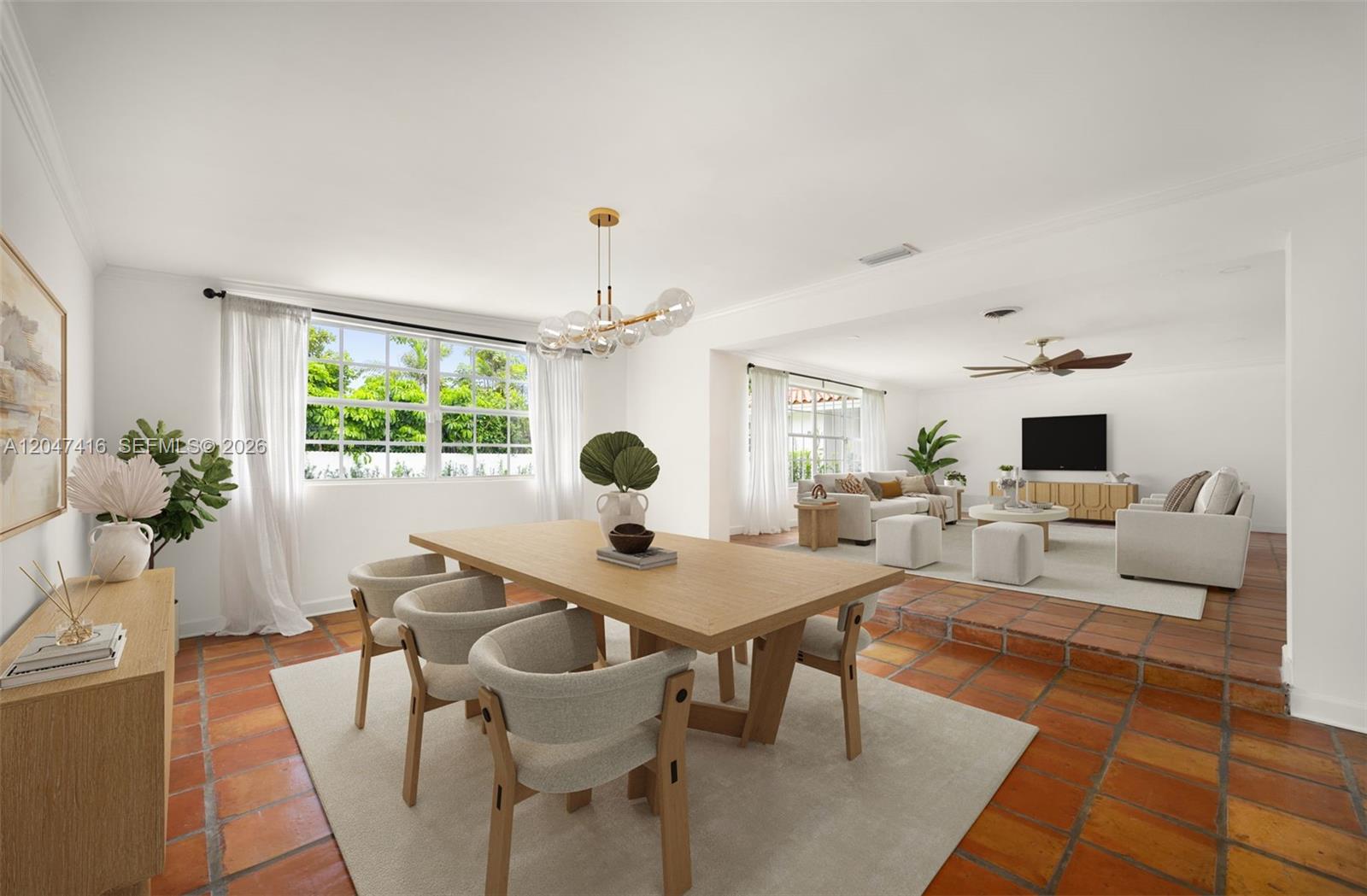 An open-concept dining and living area features terracotta tile floors and white walls — 8345 SW 90th St, Miami FL 33156, MIAMI, FL