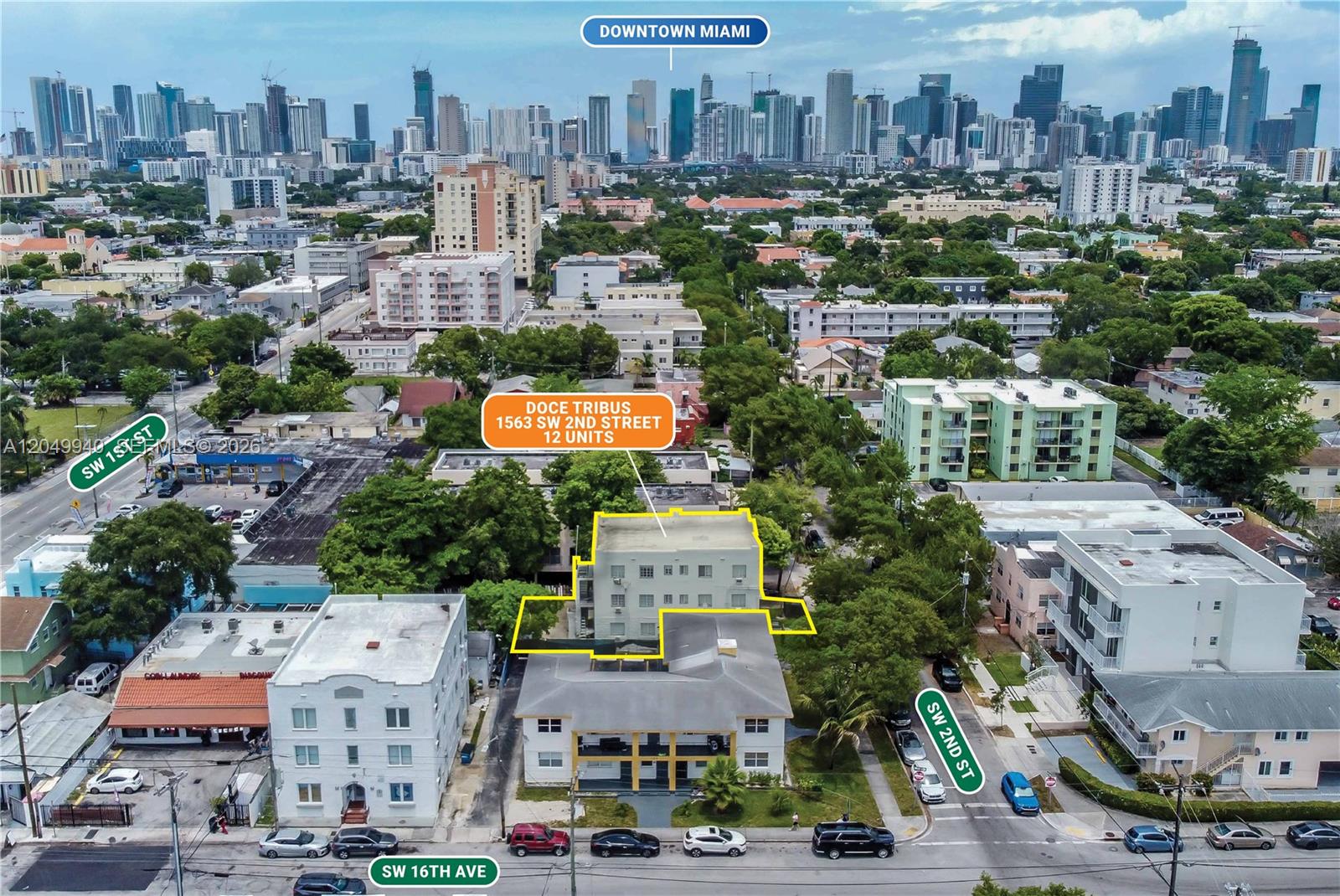 An aerial view shows two multi-story apartment buildings surrounded by trees and city streets — 1563 SW 2nd St, Miami FL 33135, MIAMI, FL