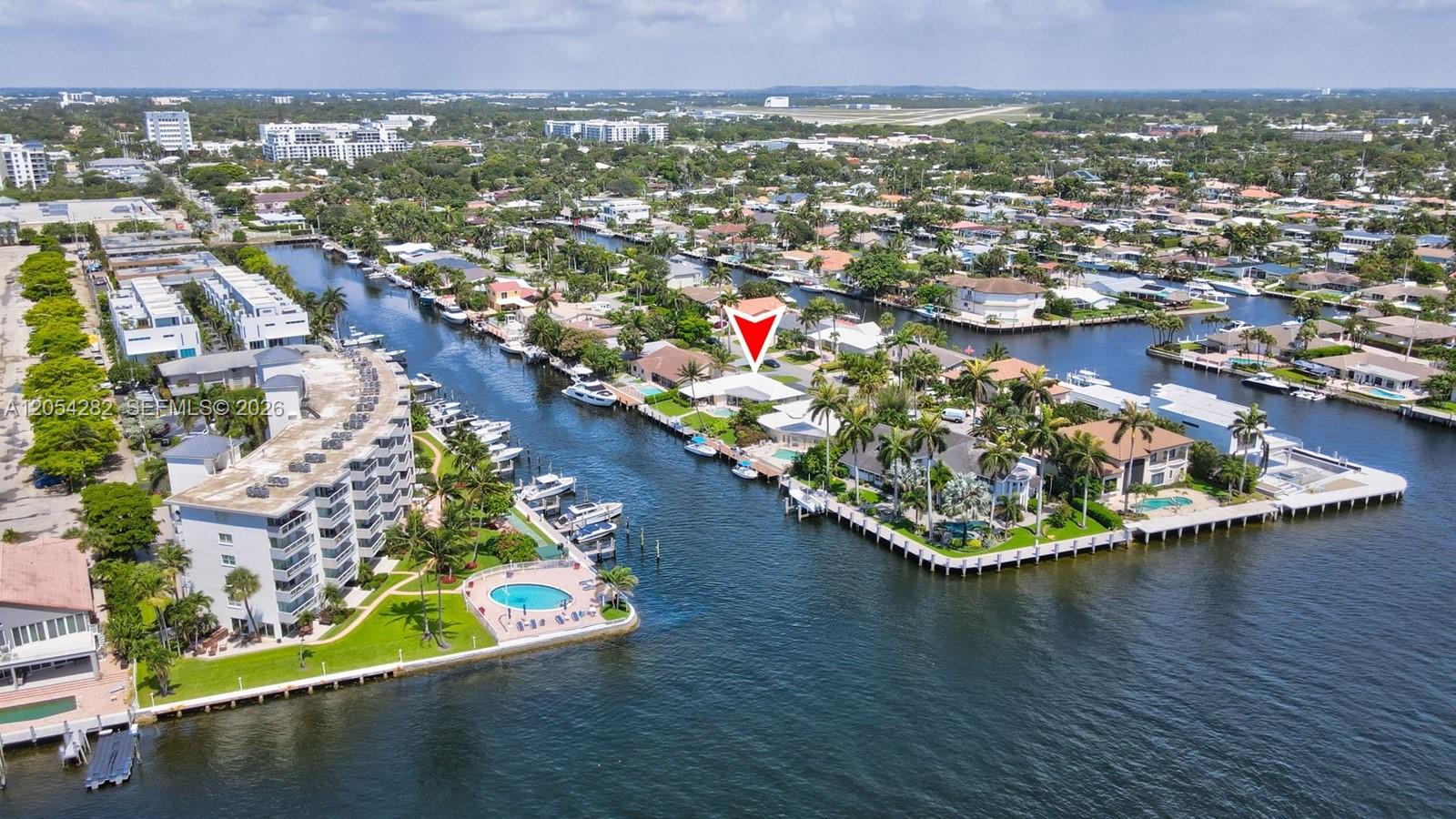 An aerial view shows a waterfront house with a pool and boat dock — 2762 NE 3rd St, Pompano Beach FL 33062, POMPANO BEACH, FL