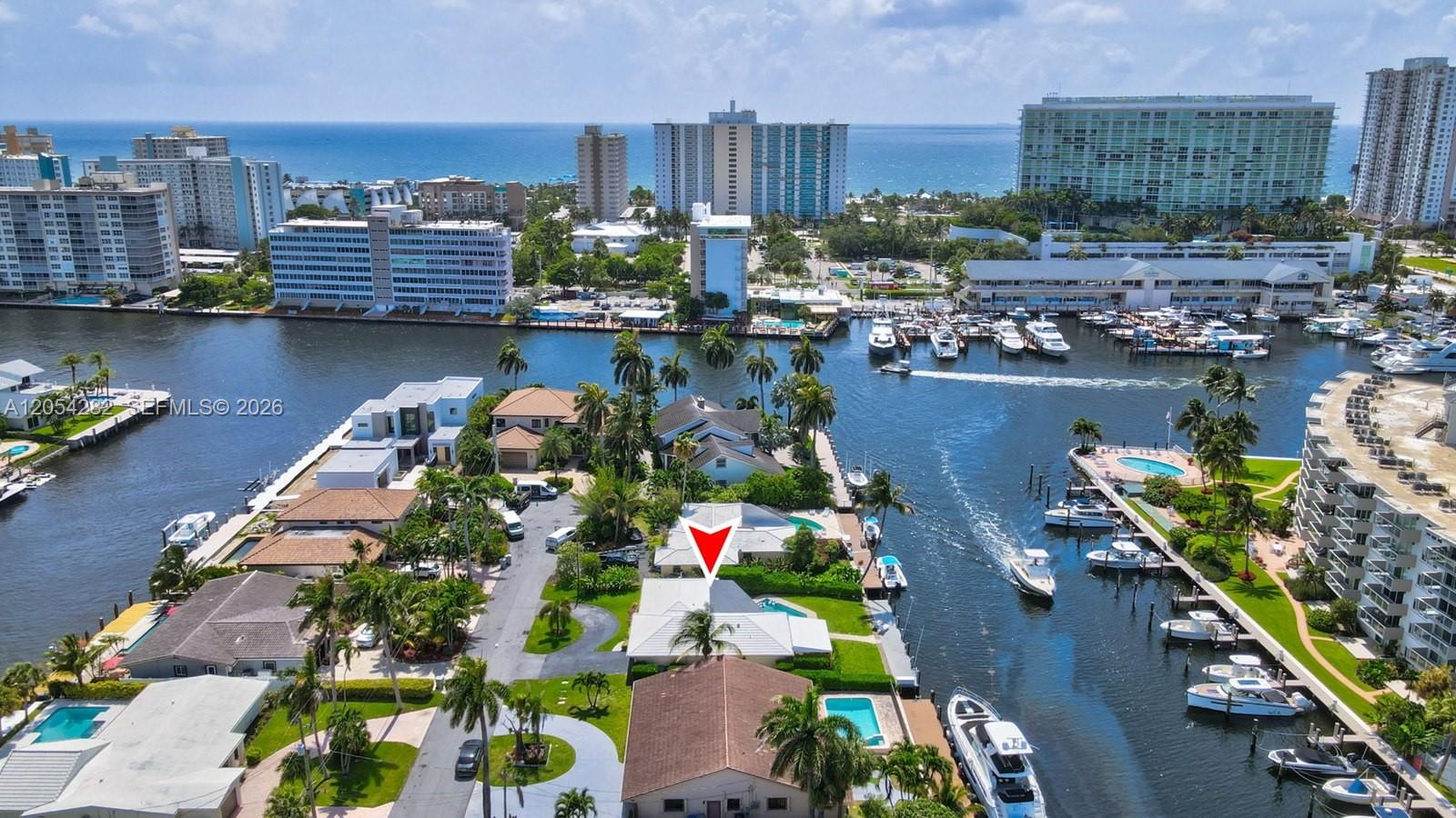 An aerial view shows a waterfront residential property with a pool and boat dock — 2762 NE 3rd St, Pompano Beach FL 33062, POMPANO BEACH, FL