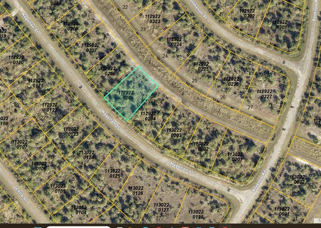 This is a satellite map showing property lot lines and parcel numbers for a residential area — 13 MAGELLAN STREET, NORTH PORT, FL