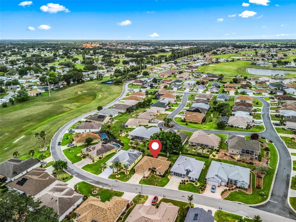 An aerial view shows a single-story house with a red pin in a residential neighborhood — 17898 SE 125TH CIRCLE, SUMMERFIELD, FL