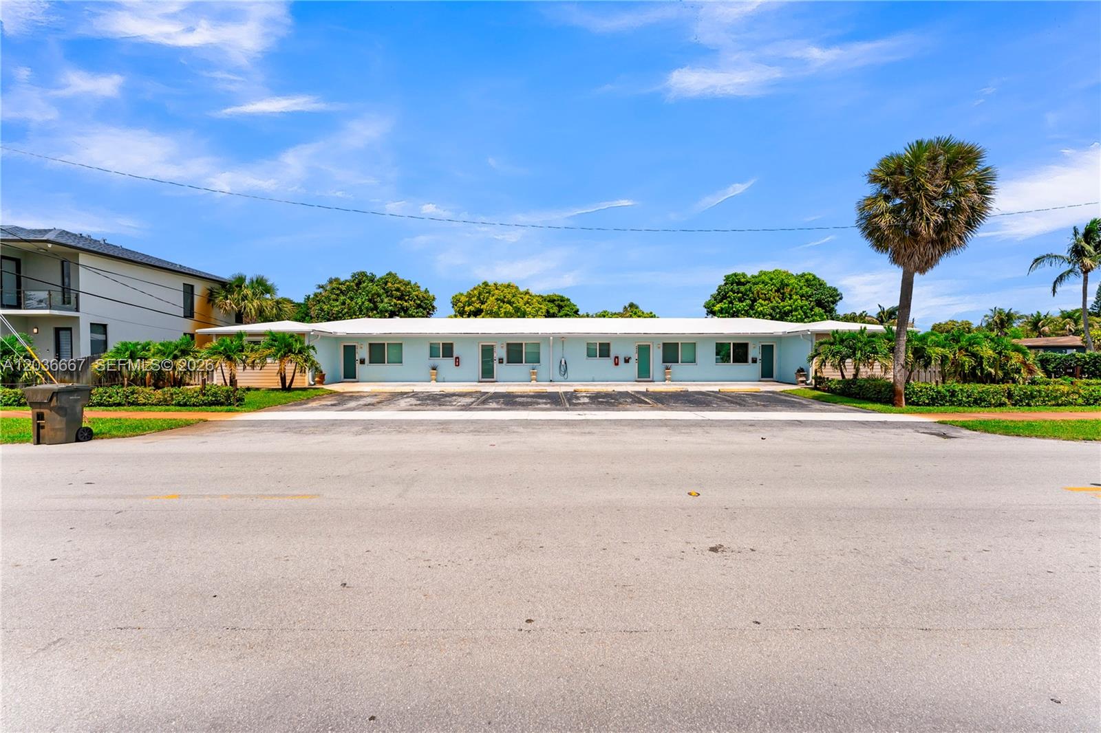 A single-story, light blue apartment building with a flat roof and front parking spaces — 4008 NW 5th Ave, Oakland Park FL 33309, OAKLAND PARK, FL