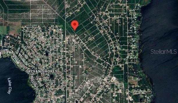 An aerial map shows a red location pin over a wooded residential area near water — 455 NICHELE BOULEVARD, LAKE PLACID, FL