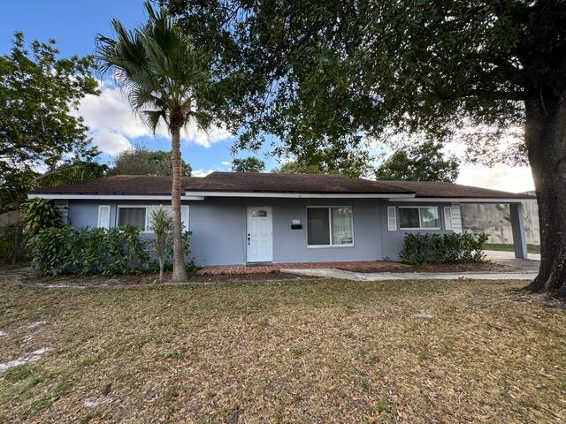 A single-story gray house with a white front door and a palm tree in front — 1632 NW 5th Street, Boca Raton FL 33486, BOCA RATON, FL