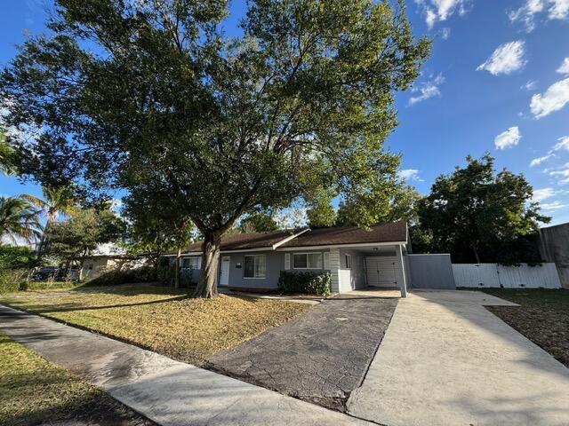 A single-story house with a large tree in the front yard and a concrete driveway — 1632 NW 5th Street, Boca Raton FL 33486, BOCA RATON, FL