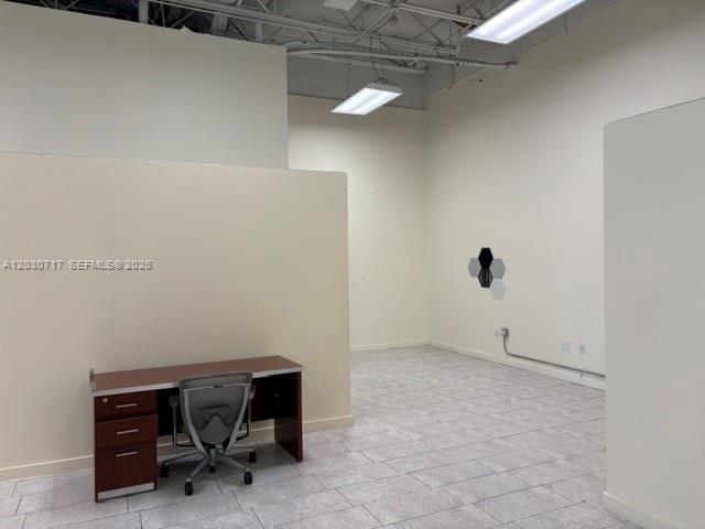A small office space features a desk, an office chair, and light-colored tile flooring — 13944 SW 8th St # 201, Miami FL 33184, MIAMI, FL