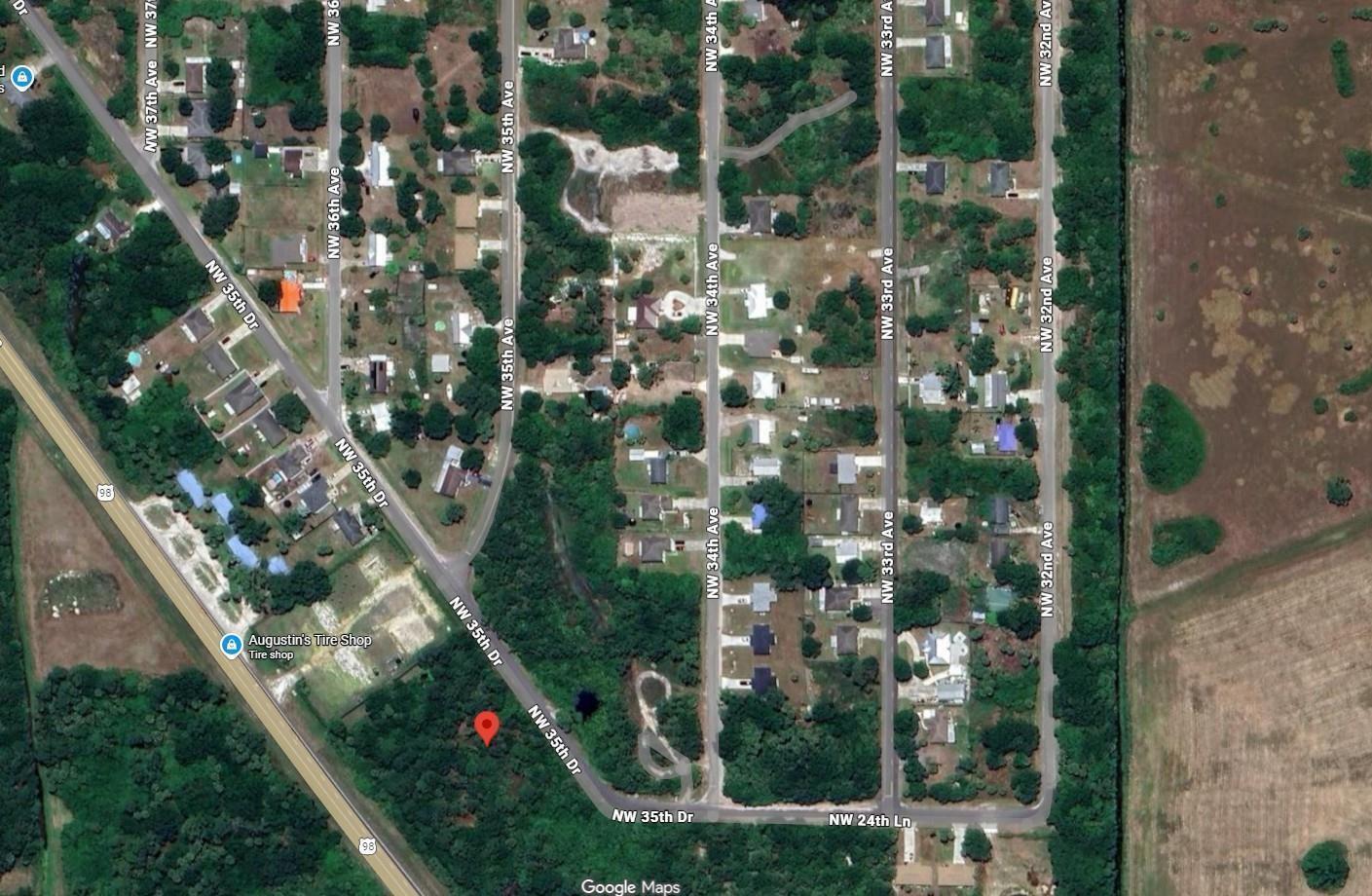 This is a satellite map view of a residential neighborhood with surrounding wooded areas — 2515 NW 35th Drive, Okeechobee FL 34972, OKEECHOBEE, FL