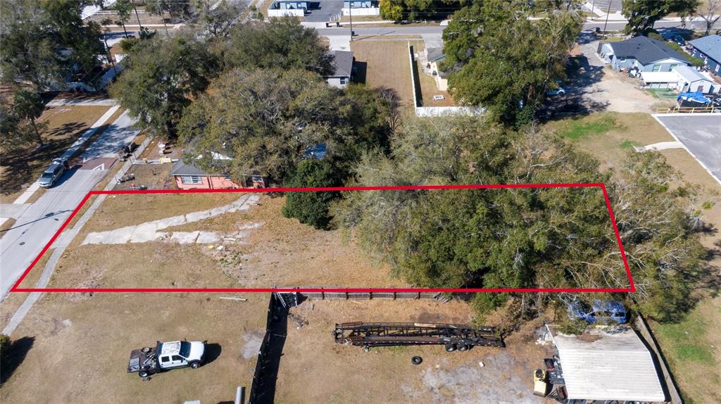 An aerial view shows a rectangular vacant lot marked by a red outline — 155 MA BOARD STREET, APOPKA, FL