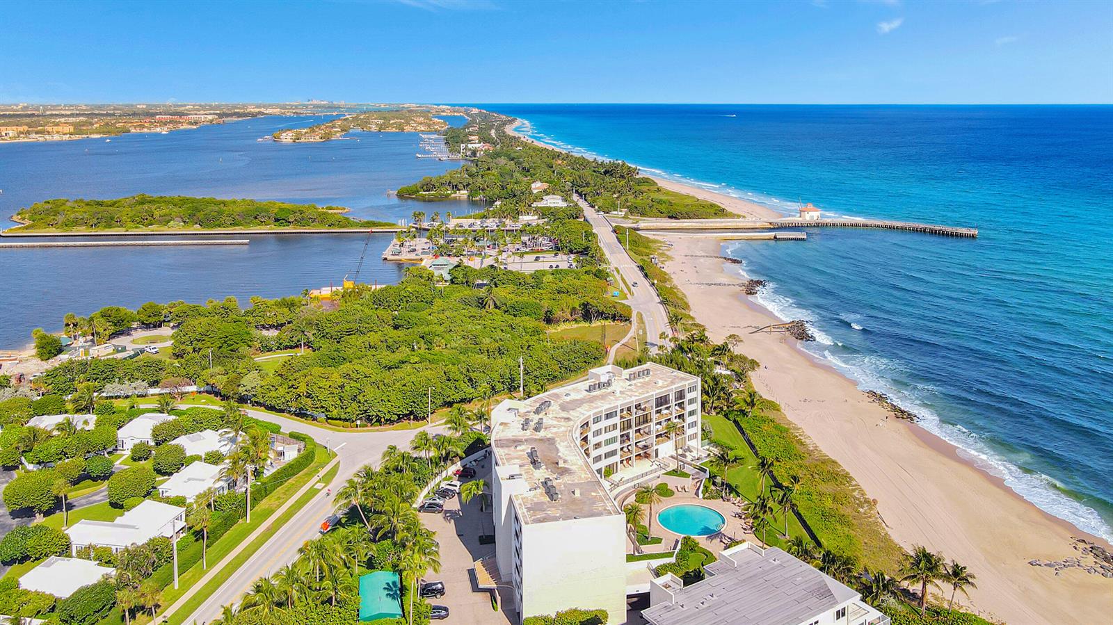An aerial view shows a beachfront condominium building next to a road and the ocean — 6885 N Ocean Boulevard # 3040, Ocean Ridge FL 33435, OCEAN RIDGE, FL