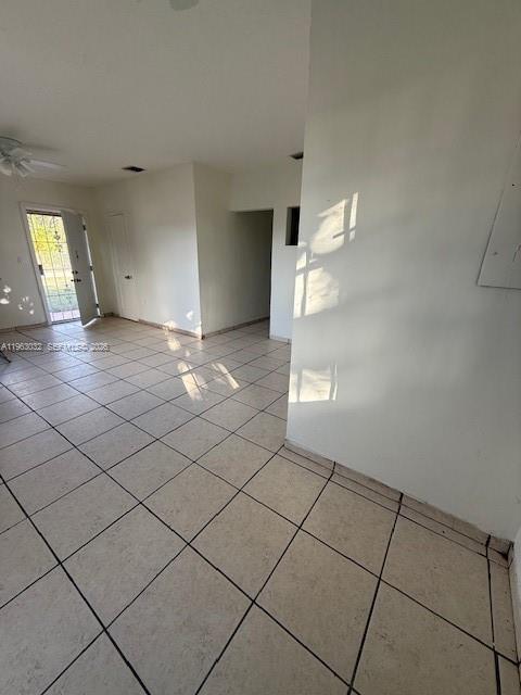 An interior view of a room with light-colored floor tiles and a doorway leading outside — 14620 Monroe St # x, Miami FL 33176, MIAMI, FL