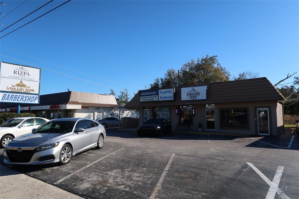 An exterior view of a commercial strip mall with a parking lot and several businesses — 1170 W STATE ROAD 436, ALTAMONTE SPRINGS, FL