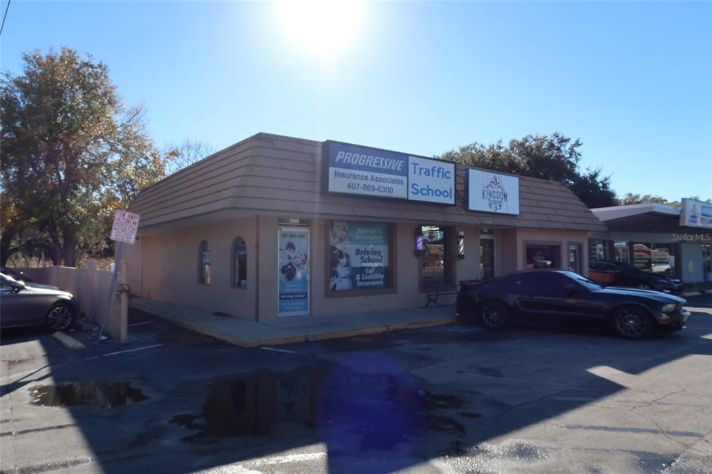 A single-story commercial building with a parking lot and signage for a traffic school — 1170 W STATE ROAD 436, ALTAMONTE SPRINGS, FL
