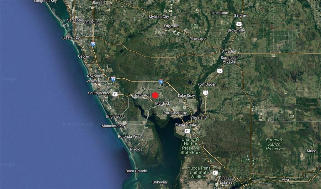 This is a satellite map showing the area around North Port, Florida, with a red marker — Lot #15 JENNINGS STREET, NORTH PORT, FL