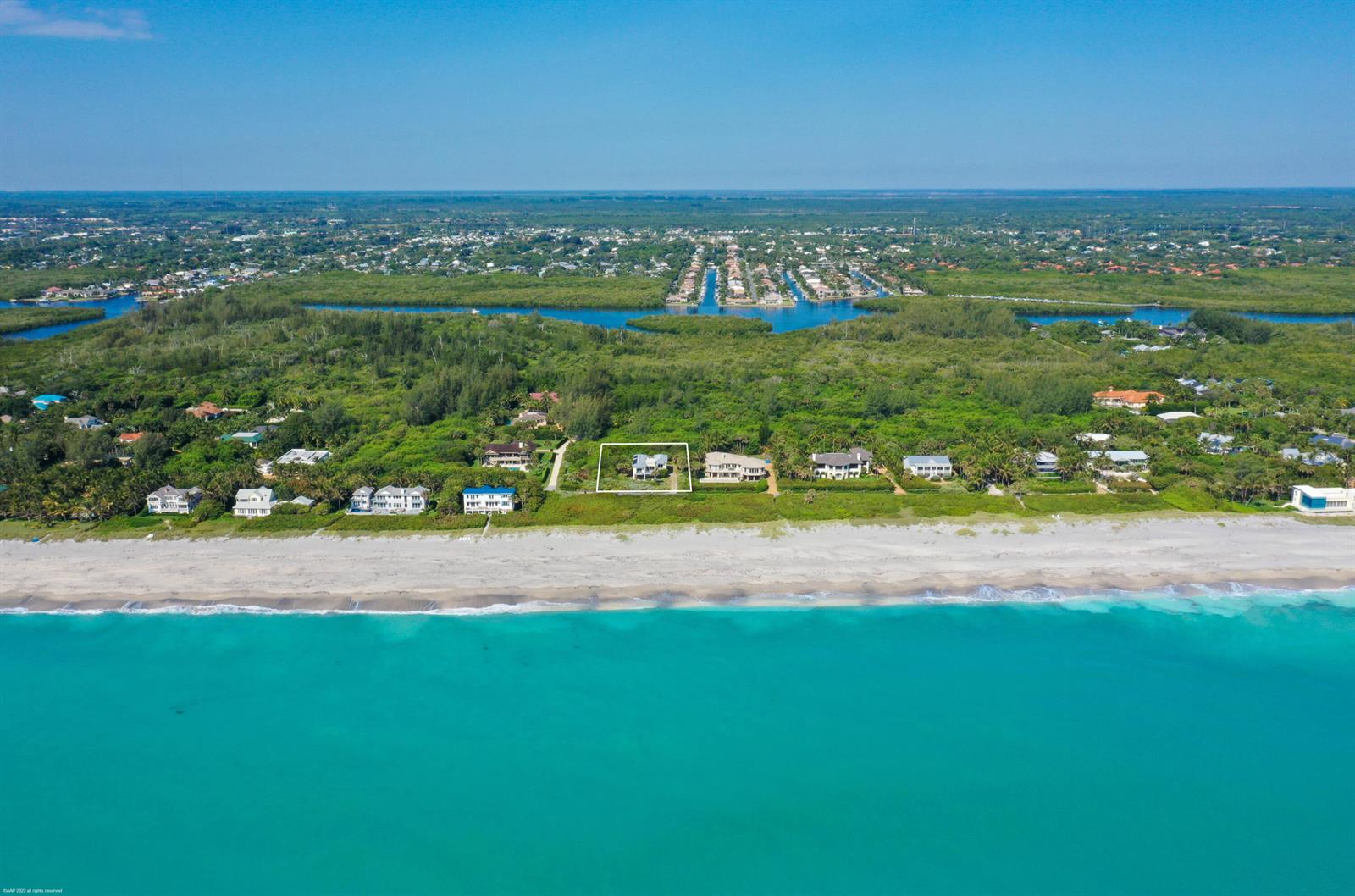 An aerial view shows a beachfront house highlighted by a white box along the coast — 116 N Beach Road, Jupiter Island FL 33455, JUPITER ISLAND, FL
