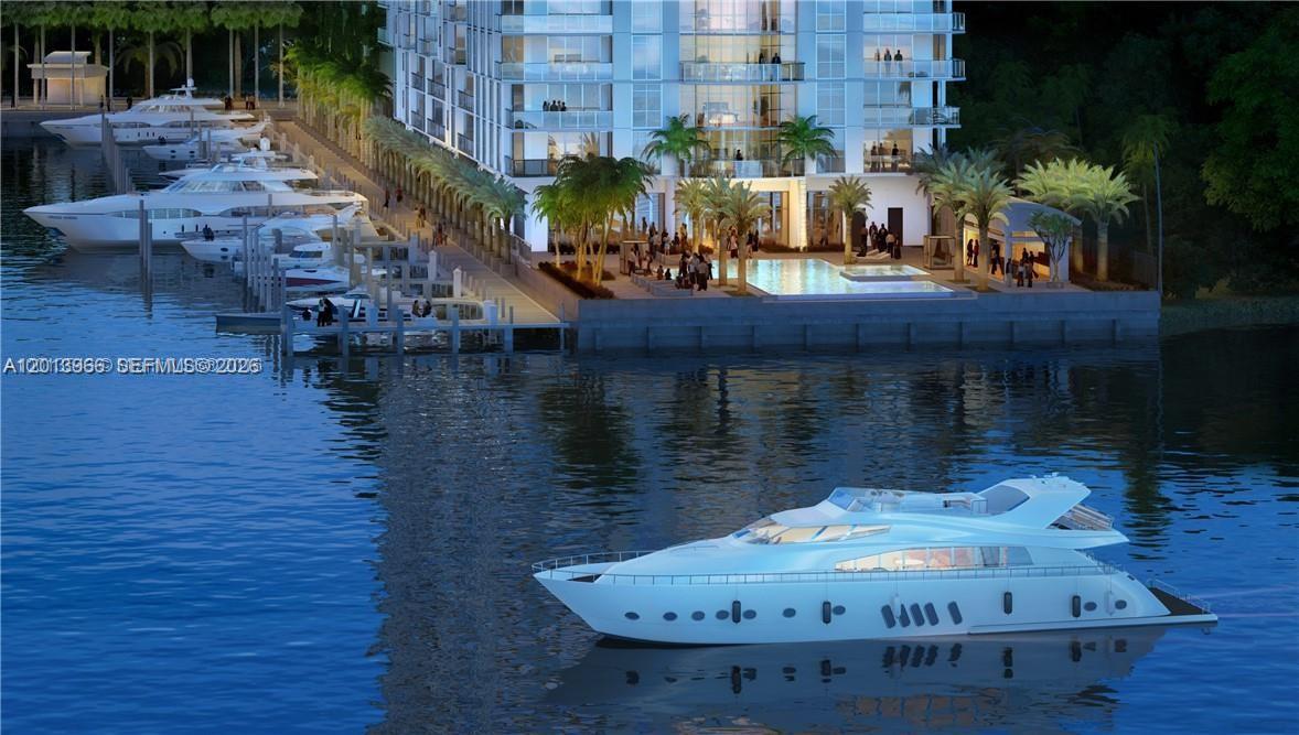 This is a rendering of a waterfront condominium building with a pool and docked yachts — NORTH MIAMI BEACH, FL