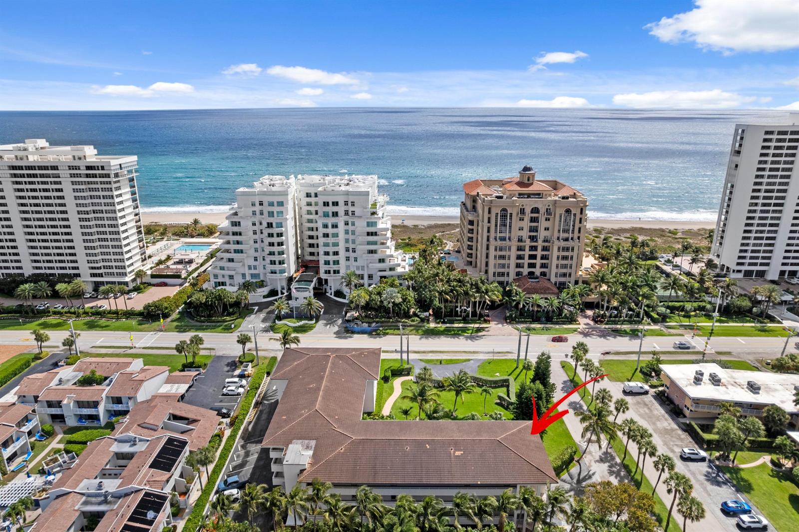 An aerial view shows a multi-story building with a brown roof near the ocean — 2501 S Ocean Boulevard # 3010, Boca Raton FL 33432, BOCA RATON, FL