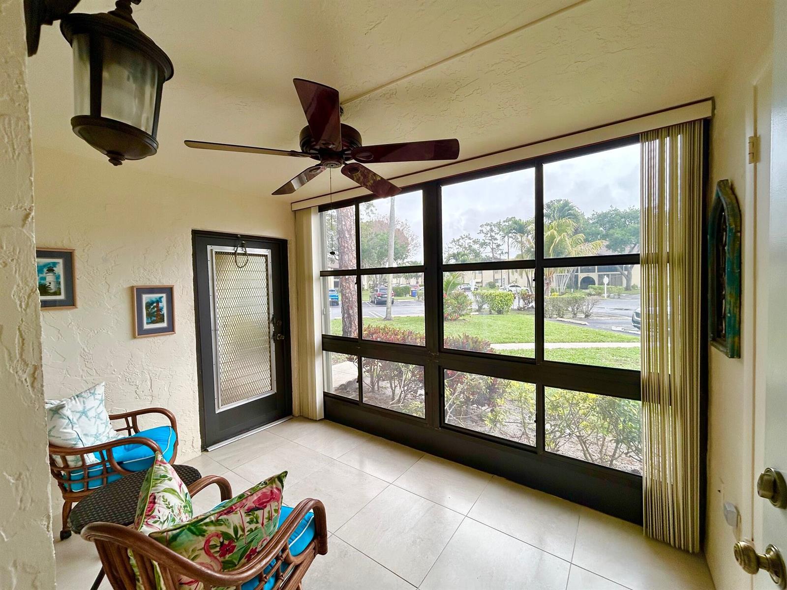A laundry room features white appliances, light green walls, and white upper cabinets — 140 Lake Pine Circle # 1, FL 33463, FL
