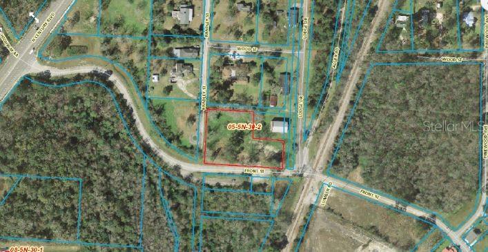 An aerial map view shows a parcel of land outlined in red near local roads — 120 FRONT STREET, CENTURY, FL