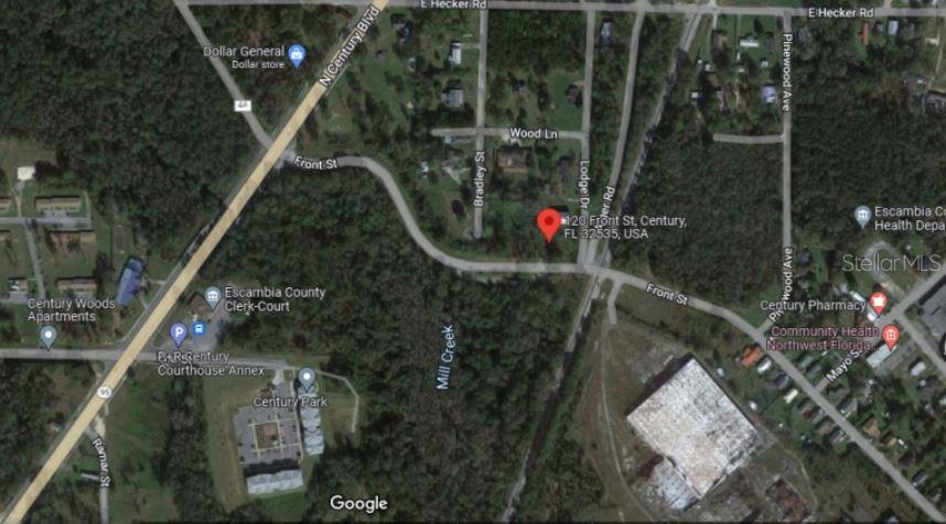 This is a satellite map view showing a property location in a wooded residential area — 120 FRONT STREET, CENTURY, FL