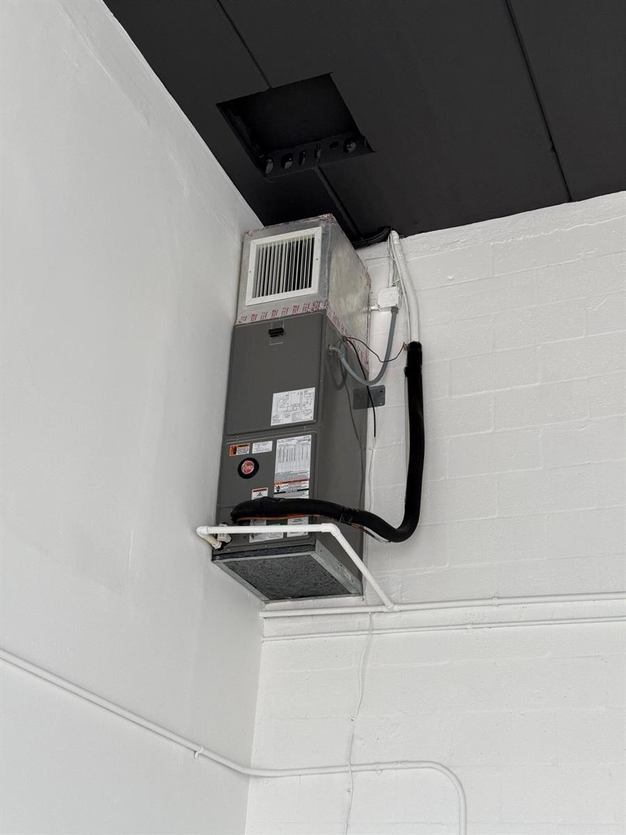 A wall-mounted HVAC air handler unit is installed in the corner of a room — 1777 Blount Road # 515, Pompano Beach FL 33069, POMPANO BEACH, FL