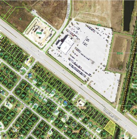 This is an aerial map showing a commercial development, nearby roads, and surrounding residential lots — 291 TAMIAMI TRAIL, PORT CHARLOTTE, FL